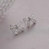 Xuhui brand exquisite and light luxury copper plated with real gold and set with zircon 925 silver needle bow, luxurious and fashionable stud earrings Item Picture